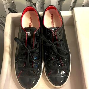 Black shiny patent converse All-Stars size women’s size 9.